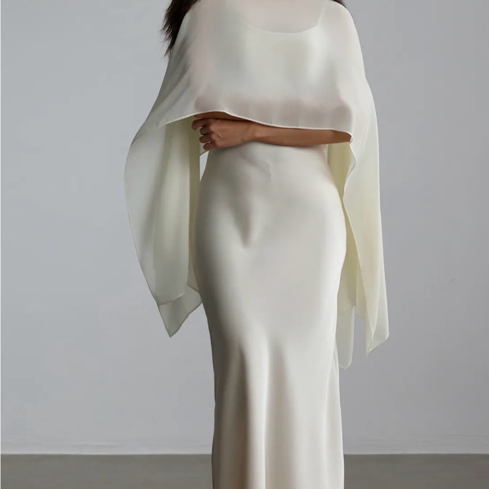 Elegant Ivory Wedding Dress with Cape Overlay